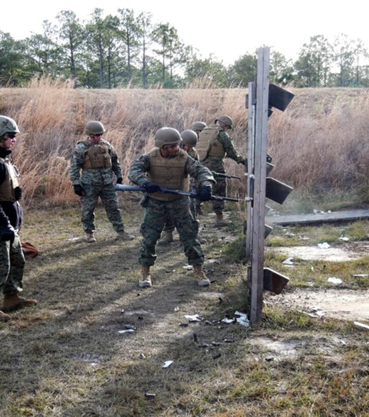 On December 16, 2016 Second Lieutenant Aaron D’Silva, a Marine attached to Combat Engineer Officer course 1-17 (CEO 1-17); breaches a door using the M500 shotgun. The shotgun is used to shoot out the hinges and locks of a door in order to detach the door from the frame and enable a successful breach. The M500 is a 12-gauge, manually operated, shoulder fired weapon and is used to augment security forces and Operating Force units, as well as a ballistic breaching tool.  

