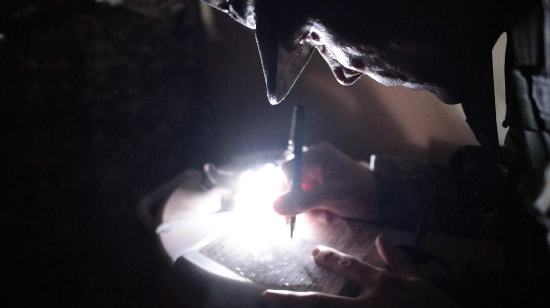 U.S. Army Staff Sgt. Zachary Morin of the 2nd Brigade, 75th Training Division writes down information for a 9-line medical evacuation during a simulated mission on February 6th, 2017 on Ft. Hunter Liggett, Calif. Morin competed in the 91st Training Division's Best Warrior Competion that assessed his proficiency in warrior tasks and battle drills. (U.S. Army photo by Spc. Derek Cummings/Released)