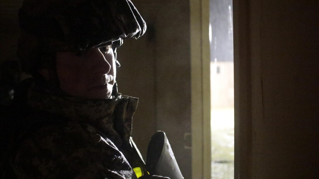 U.S. Army Staff Sgt. Matthew Cassidy of the 2-310th, 86th Training Division guards an open doorway during a simulated extraction mission on February 6th, 2017 on Ft. Hunter Liggett, Calif. Cassidy competed in the 91st Training Division's Best Warrior Competition that assessed his proficiency in warrior tasks and drills. (U.S. Army photo by Spc. Derek Cummings/Released)