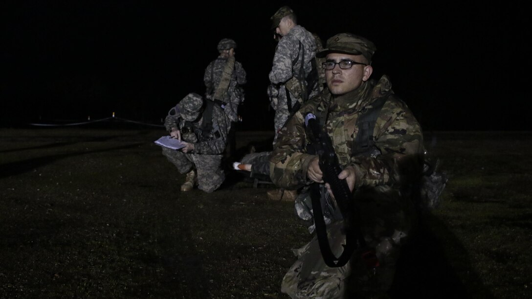 U.S. Army Pfc. Juan Millan of the 75th Training Division pulls guard during a simulated extraction mission on February 6th, 2017 on Ft. Hunter Liggett, Calif. Millan competed in the 91st Training Division's Best Warrior Competition that assesed his proficiency in various warrior tasks and drills. (U.S. Army photo by Spc. Derek Cummings/Released)