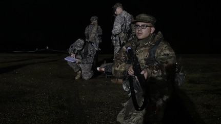 U.S. Army Pfc. Juan Millan of the 75th Training Division pulls guard during a simulated extraction mission on February 6th, 2017 on Ft. Hunter Liggett, Calif. Millan competed in the 91st Training Division's Best Warrior Competition that assesed his proficiency in various warrior tasks and drills. (U.S. Army photo by Spc. Derek Cummings/Released)