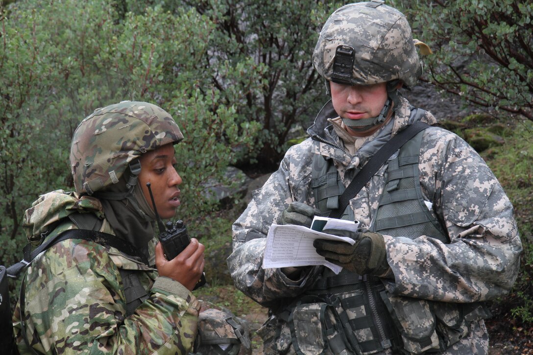 U.S. Army Sgt. Zachary Greene (right) and Spc. Keenesha Rogers call in a 9-line medical evacuation during a simulated mission on February 7th, 2017 on Ft. Hunter Liggett, Calif. The soldiers competed in the 91st Training Division's Best Warrior Competition that assessed their proficiency in multiple warrior tasks and battle drills. (U.S. Army photo by Spc. Derek Cummings/Released)