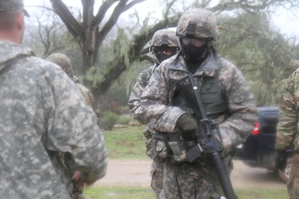 U.S. Army soldiers competeting in the 91st Training Division's Best Warrior Competition receive instruction during a simulated mission on February 7th, 2017 on Ft. Hunter Liggett, Calif. The soldiers were tested on their warrior tasks and battle drills to see who was the most proficient. (U.S. Army photo by Spc. Derek Cummings/Released)