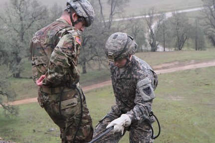 U.S. Army Staff Sgt. Matthew Cassidy of the 2-310th, 86th Training Division prepares to rapel down a rock face on February 7th, 2017 on Ft. Hunter Liggett, Calif. Cassidy participated in the 91st Training Division's Best Warrior Competition that assessed his proficiency in warrior tasks and battle drills. (U.S. Army photo by Spc. Derek Cummings/Released)