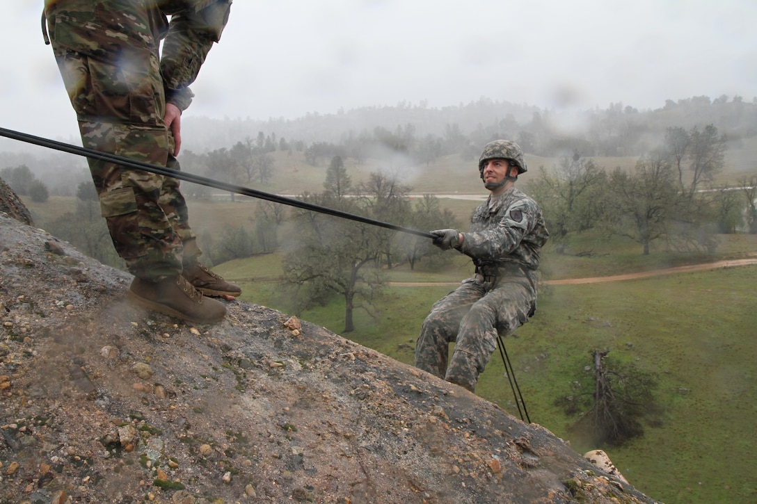 U.S. Army Sgt. Robert Beedle of the 11-104th, 91st Training Division rapels down a rock face during a confidence course on February 7th, 2017 on Ft. Hunter Liggett, Calif. Beedle competed in the 91st Training Division's Best warrior competition that tested their endurance and knowledge of warrior tasks and drills. (U.S. Army photo by Spc. Derek Cummings/Released)