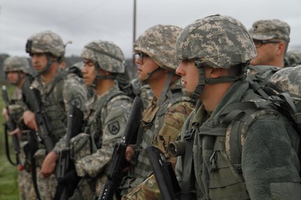 U.S. Army Pfc. Max Lanzing of the 75th Training Division and soldiers competing in the 91st Training Division's Best Warrior Competition (BWC) recieve instrutcion at the starting point of a ruck march on February 8th, 2016 on Ft. Hunter Liggett, Calif. The BWC tested soldiers on their warrior tasks and drills to deterrmine who will move on to the next level of the competition. (U.S. Army photo br Spc. Derek Cummings/Released)