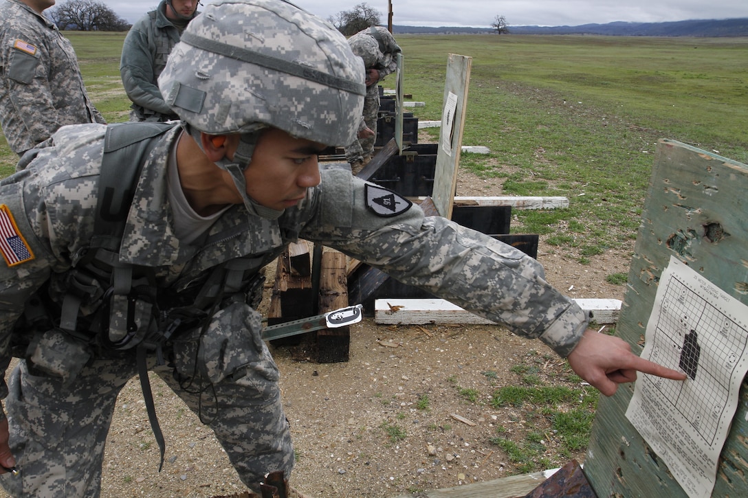 U.S. Army Sgt. Kinoroy Quilaton points out where his rounds hit during a weapon zeroing on February 8th, 2017 on Ft. Hunter Liggett, Calif. Soldiers zeroed and qualified with the M16/A2 rifle as part of the 91st Training Division's Best Warrior Competition that assesed their proficiency on warrior tasks and drills. (U.S. Army photo by Spc. Derek Cummings/Released)