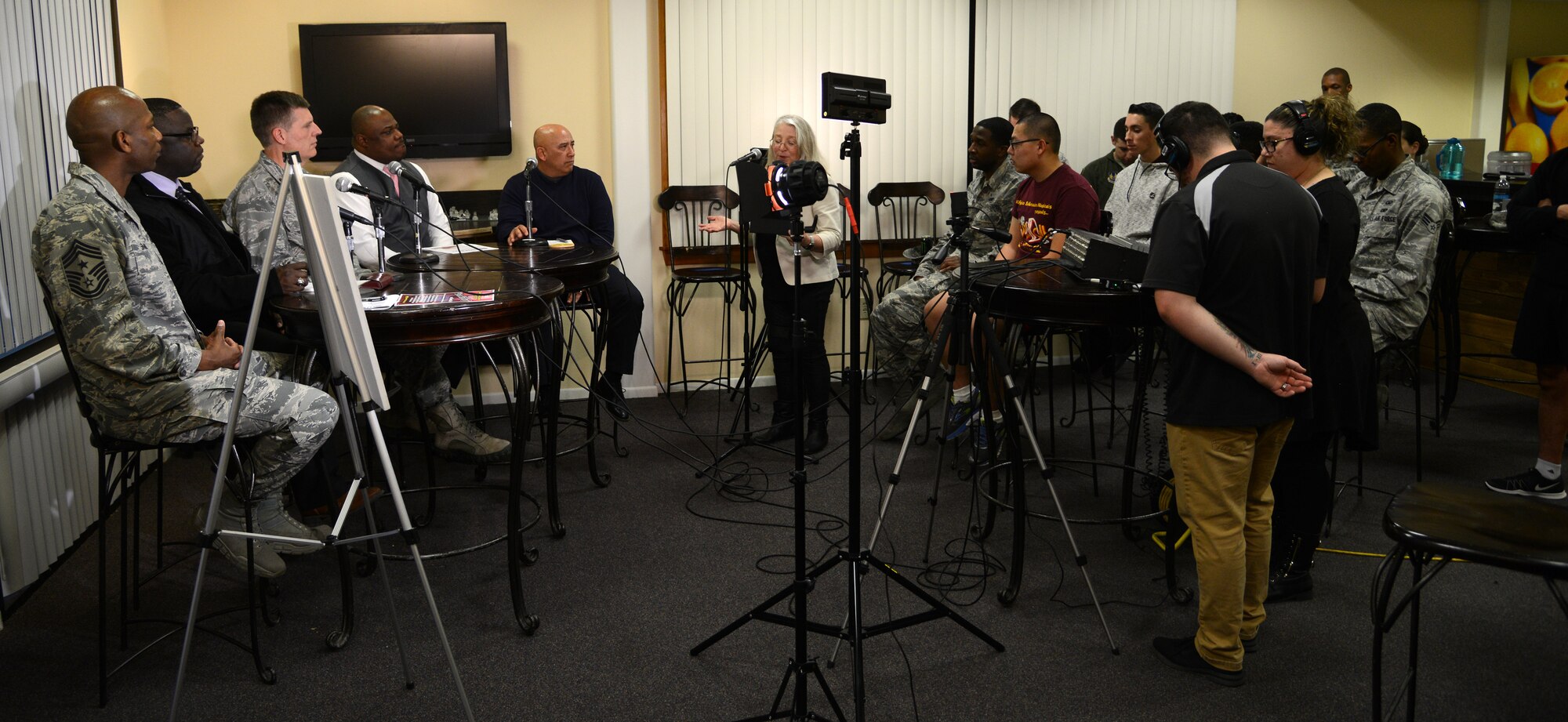 Chief Master Sergeant Todd Simmons (left), 412th Test Wing command chief, uses social media to be sure his voice is hear far and wide Feb. 8 during a Facebook Live broadcast titled “From the Top” from the Higher Grounds internet café in the dormitory complex.
Edwards top enlisted leader was joined by a panel of experts – Damion Hart, 412th Force Support Squadron food service officer; Chaplain (Maj.) John Von Almen, 412th Test Wing; Quintin Pollard, personal finance manager with the 412th FSS;   and Robin Nobriga, chief of quality assurance with the 412th Comptroller Squadron – share their knowledge with Edwards Airmen to help mitigate the effects of the closure of Edwards’ Dining Facility. The facility is scheduled to close for approximately three months for renovation.
According to the chief, there will be more Facebook Live events in the future, as this is a very effective and far-reaching way to communicate. Edwards is one of the few Air Force bases to use Facebook Live as part of its communication strategy. This was the first time Edwards has used Facebook Live as a town hall style format.
