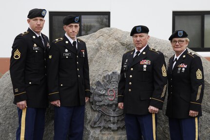 U.S. Army Command Sgts. Maj. Denise McCleary (far right) and James Shuldberg (center right), Staff Sgt. Samuel Clark (far left) and Spc. Jordan Howes (center left) pose for a group photo on February 9th, 2017 on Ft. Hunter Liggett, Calif. Howes competed in the 91st Training Division's Best warrior competition that tested his endurance and knowledge of warrior tasks and drills. (U.S. Army photo by Spc. Derek Cummings/Released)