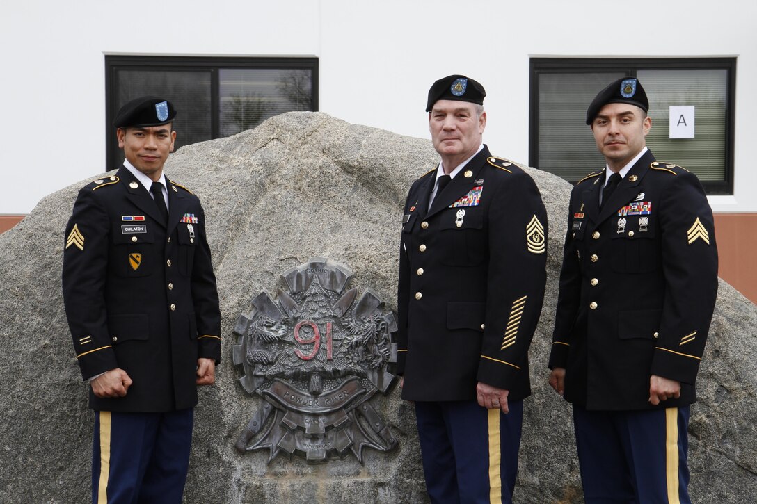 U.S. Army Command Sgt. Maj. Lawrence G. May (center) Sgt. Kinoroy Quilaton, Sgt. Juan Padilla of the 91st Training Division pose for a group picture on February 9th, 2017 on Ft. Hunter Liggett, Calif. Both Quilaton and Padilla competed in the 91st Training Division's Best warrior competition that tested their endurance and knowledge of warrior tasks and drills. (U.S. Army photo by Spc. Derek Cummings/Released)