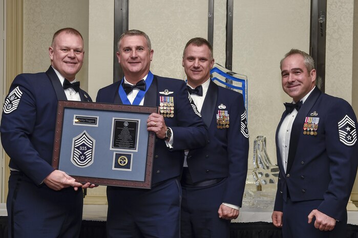 From left to right: retired Chief Master Sgt. James Roy, 16th Chief Master Sergeant of the Air Force, recognizes Chief Master Sgt. Phillip Thigpen, 315th Operations Group superintendent, along with Chief Master Sgt. Mark Barber, 315th Airlift Wing command chief, and Chief Master Sgt. Kristopher K. Berg, 437th Airlift Wing command chief, during the chief master sergeant recognition ceremony at the Charleston Club Feb. 11, 2017. Chief master sergeant is the highest enlisted rank in the Air Force held by one percent of the enlisted force.  