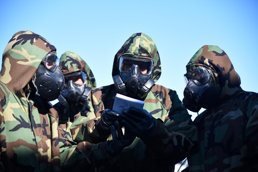 349th Civil Engineer Squadron Citizen Airmen participate in chemical, biological, explosive, radiological, and nuclear training during exercise Patriot Wyvern at Travis Air Force Base, Calif., Feb. 11, 2017. Airmen use the Airman's Manual to verify proper procedures during chemical, biological, radiological, nuclear and explosives training events. (U.S. Air Force photo by Senior Airman Sam Salopek)