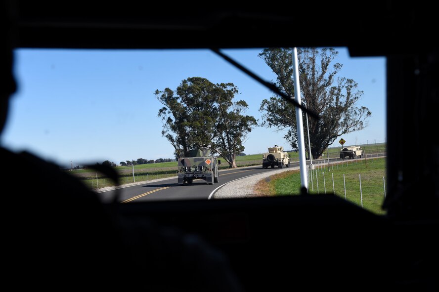 Senior Airman Stefiana Barnes, 349th Security Forces Squadron, drives a Humvee during convoy training for Patriot Wyvern at Travis Air Force Base, Calif., on Feb. 11, 2017. Security Forces Citizen Airmen encountered simulated improvised explosive devices and malfunctions as they traveled to Conex Village training site. (U.S. Air Force photo by Senior Airman Sam Salopek) 