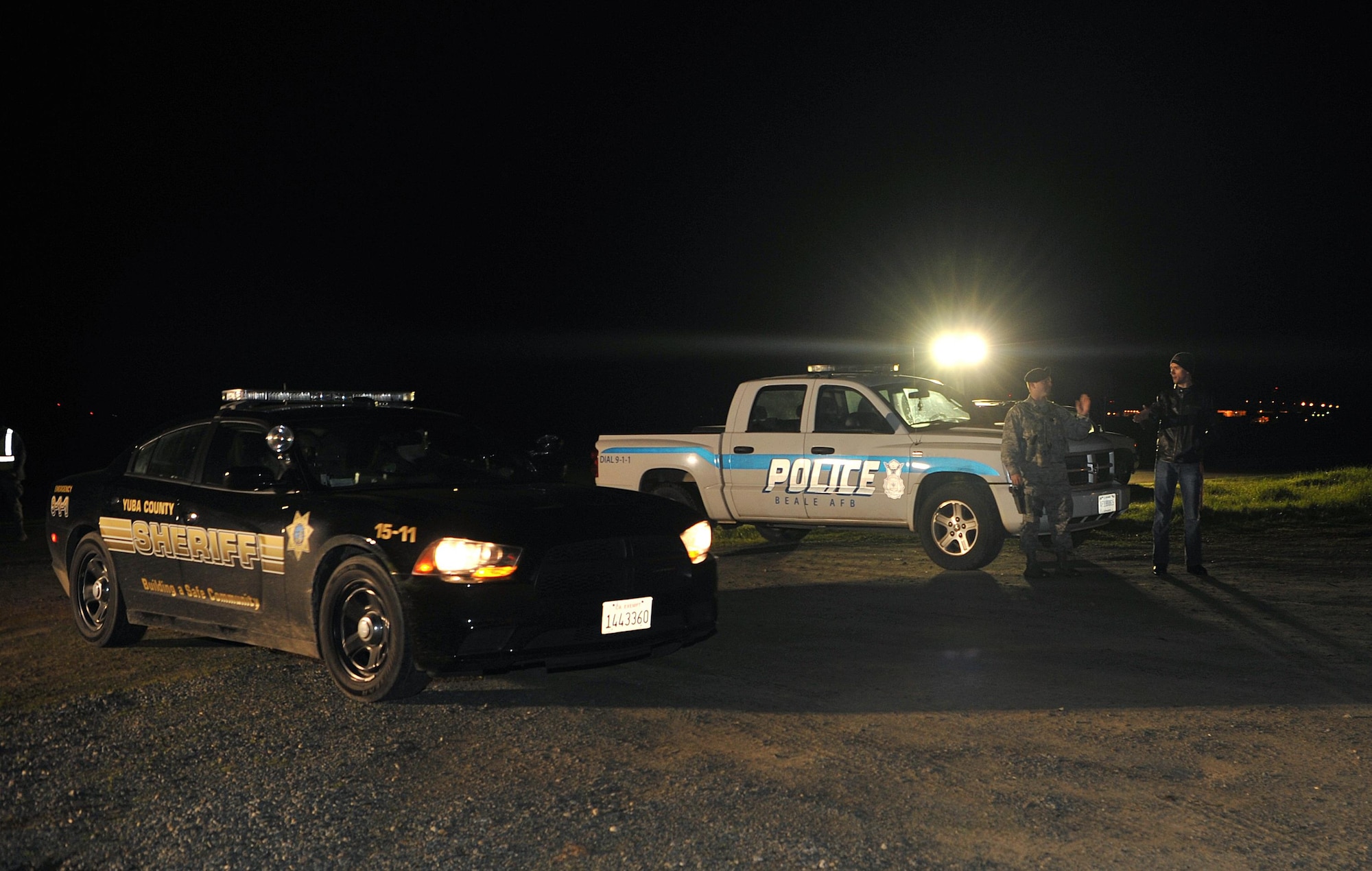 The 9th Security Forces Squadron coordinates with the Yuba County Sheriff’s Office to provide evacuees shelter in response to the Oroville spillway evacuation notice at Beale Air Force Base, California, Feb. 12, 2017. Beale hosted approximately 400 evacuees from surrounding communities. (U.S. Air Force photo/Airman Tristan D. Viglianco)