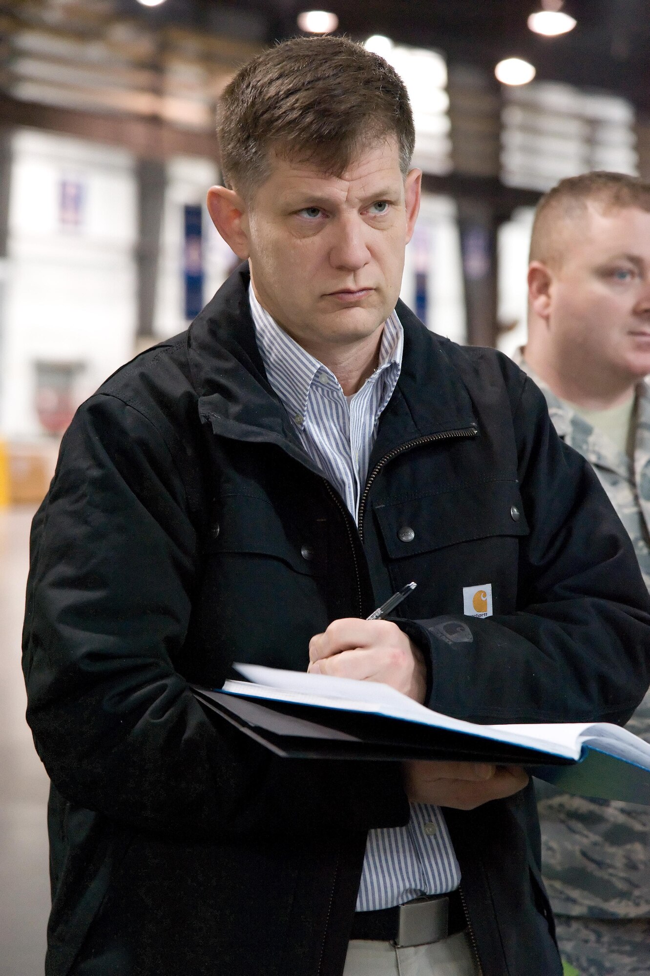 Mr. William Adams, a scientist with the Navy Center for Applied Research in Artificial Intelligence, Washington, D.C., takes notes on the inbound freight processing procedures used by the 436th Aerial Port Squadron truck dock personnel Feb. 7, 2017, at Dover Air Force Base, Del. Williams was part of an Air Mobility Command military and civilian study team that observed many facets of the Super Port during their four-day visit. (U.S. Air Force photo by Roland Balik)