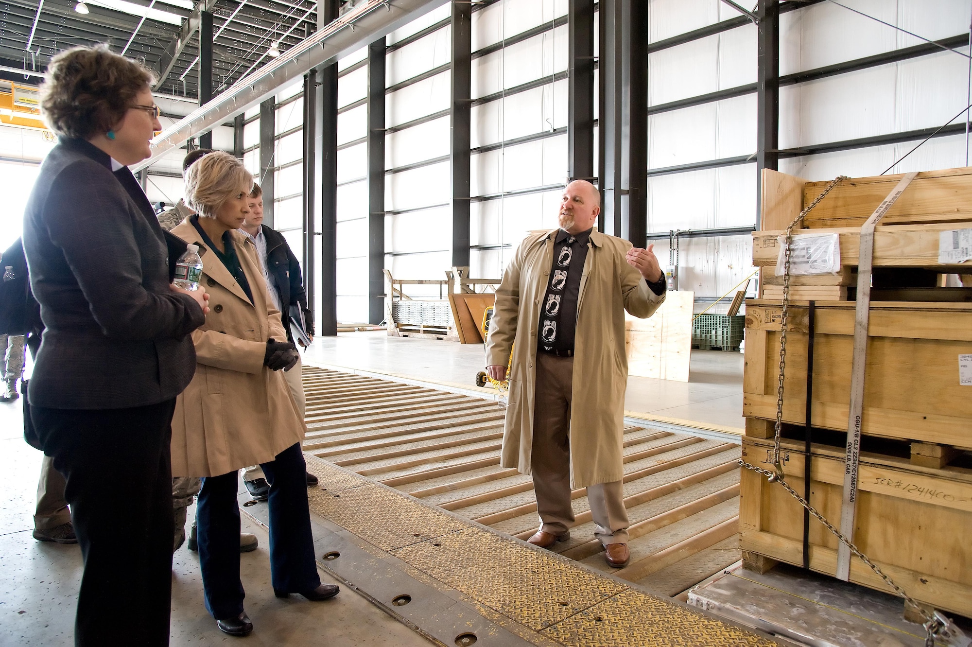 Dr. Donna Senft, Air Mobility Command chief scientist, left, and Sara Keller, AMC Logistics, Engineering, Force Protection deputy director, both assigned to Scott Air Force Base, Ill., listen to Jim Ewing, 436th Aerial Port Squadron operations manager, explain pallet build up and processing of oversized cargo by aerial port personnel Feb. 7, 2017, at Dover Air Force Base, Del. Senft and Keller were part of AMC’s “Aerial Port of the Future” study team that observed practices and procedures used by Super Port personnel. (U.S. Air Force photo by Roland Balik)