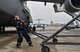 Senior Airman Earl Shelton, 721st Aircraft Maintenance Squadron aerospace maintenance technician, marshals a C-5M Super Galaxy into place at Ramstein Air Base, Germany, Jan. 24, 2017. After it was in place, 721st AMXS Airmen chocked the wheels, plugged it into a generator, checked tire pressure, refilled oil, and refueled the aircraft. On average, the 721st AMXS inspects, services, and repairs 30 aircraft in a single day, as part of the 521st Air Mobility Operations Wing at Ramstein.  (U.S. Air Force photo by Senior Airman Tryphena Mayhugh)