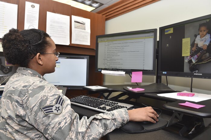Senior Airman Menebere Haileselassie, 628th Comptroller Squadron financial management technician, works at her desk Feb. 3, 2017, at Joint Base Charleston, South Carolina. Haileselassie was born in Ethiopia and sent to the U.S. by her parents with her older sister at age 11. 