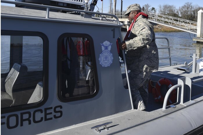 U.S. Air Force Brig. Gen. Stacey T. Hawkins, Air Mobility Command Logistics, Engineering and Force Protection director, boards a boat Feb. 10, 2017, at Joint Base Charleston -- Naval Weapons Station, South Carolina. Hawkins visited multiple facilities on JB Charleston during his visit to meet with Airmen and senior leaders to discuss operations.