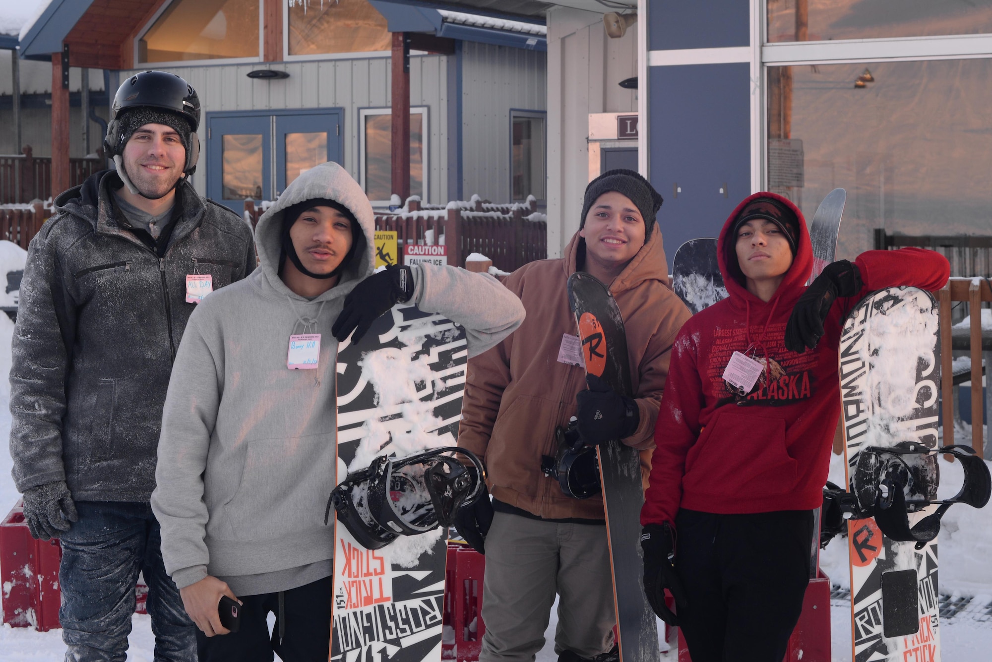 U.S. Air Force Airmen from Eielson Air Force Base, Alaska, pose in front of the Ski Lodge at Birch Hill, Feb. 3, 2017, on Fort Wainwright, Alaska. Thirteen Airmen from Eielson attended the skiing and snowboarding event hosted by Better Opportunities for Single Soldiers. (U.S. Air Force photo by Airman Eric M. Fisher)