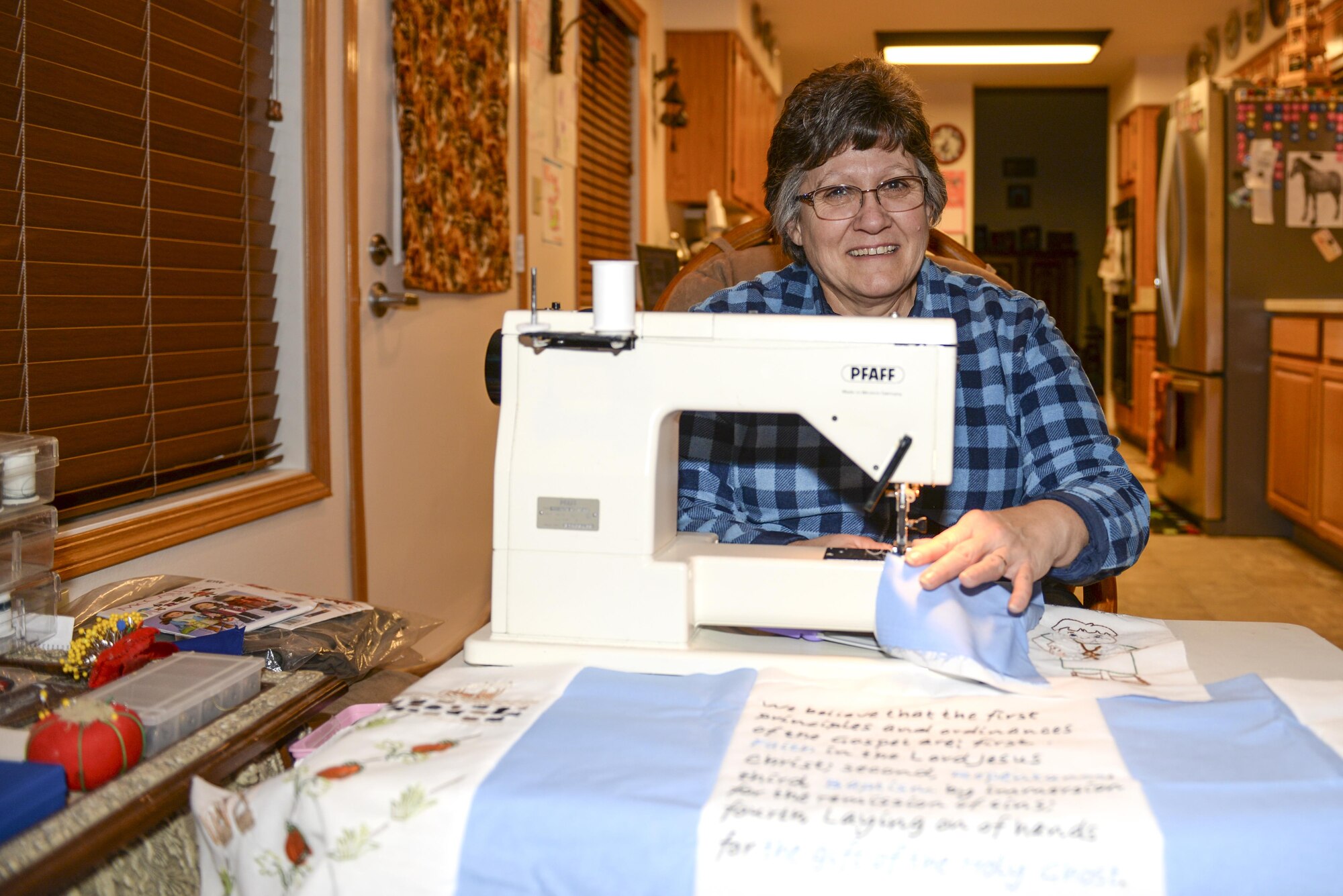 Department of the Air Force employee Kristina Anderson, a 354th Fighter Wing legal office receptionist secretary, takes a brief break from sewing Feb. 10, 2017, at Eielson Air Force Base, Alaska. Anderson enjoys sewing and doing activities with the 354th Medical Group Key Spouses. (U.S. Air Force photo by Airman Isaac Johnson)