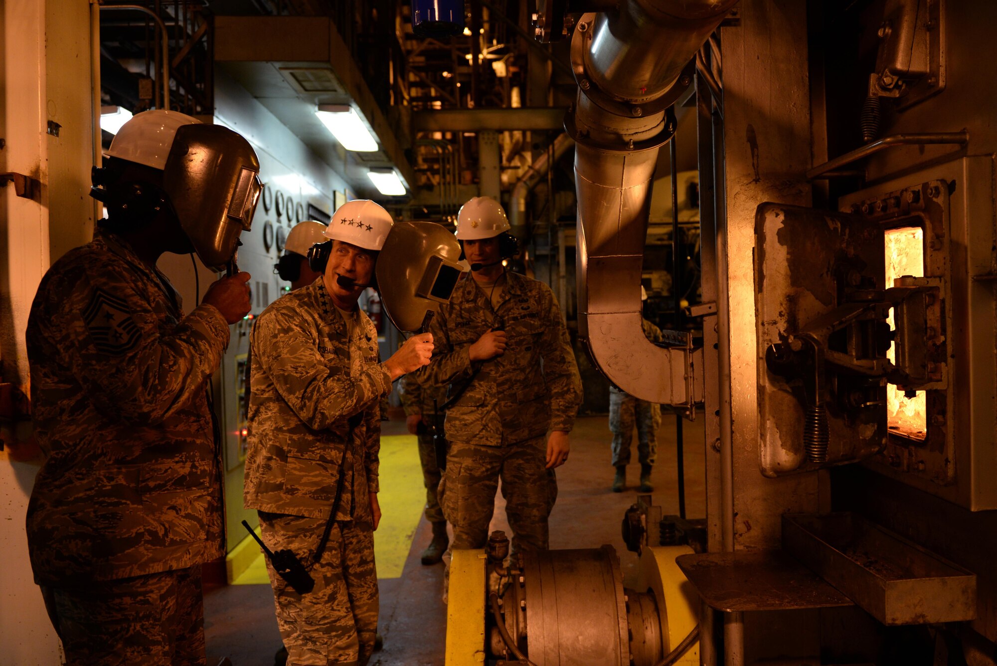 U.S. Air Force Gen. Terrence O’Shaughnessy, Pacific Air Forces commander, and Chief Master Sgt. Anthony Johnson, Pacific Air Forces command chief, observe operations during a tour of the Central Heat and Power Plant (CHPP) during a base visit at Eielson Air Force Base, Alaska, Feb. 8, 2017. The CHPP uses about 180,000 tons of coal to provide heat and electricity for the Eielson mission and its residents year round. (U.S. Air Force photo by Airman 1st Class Cassandra Whitman)