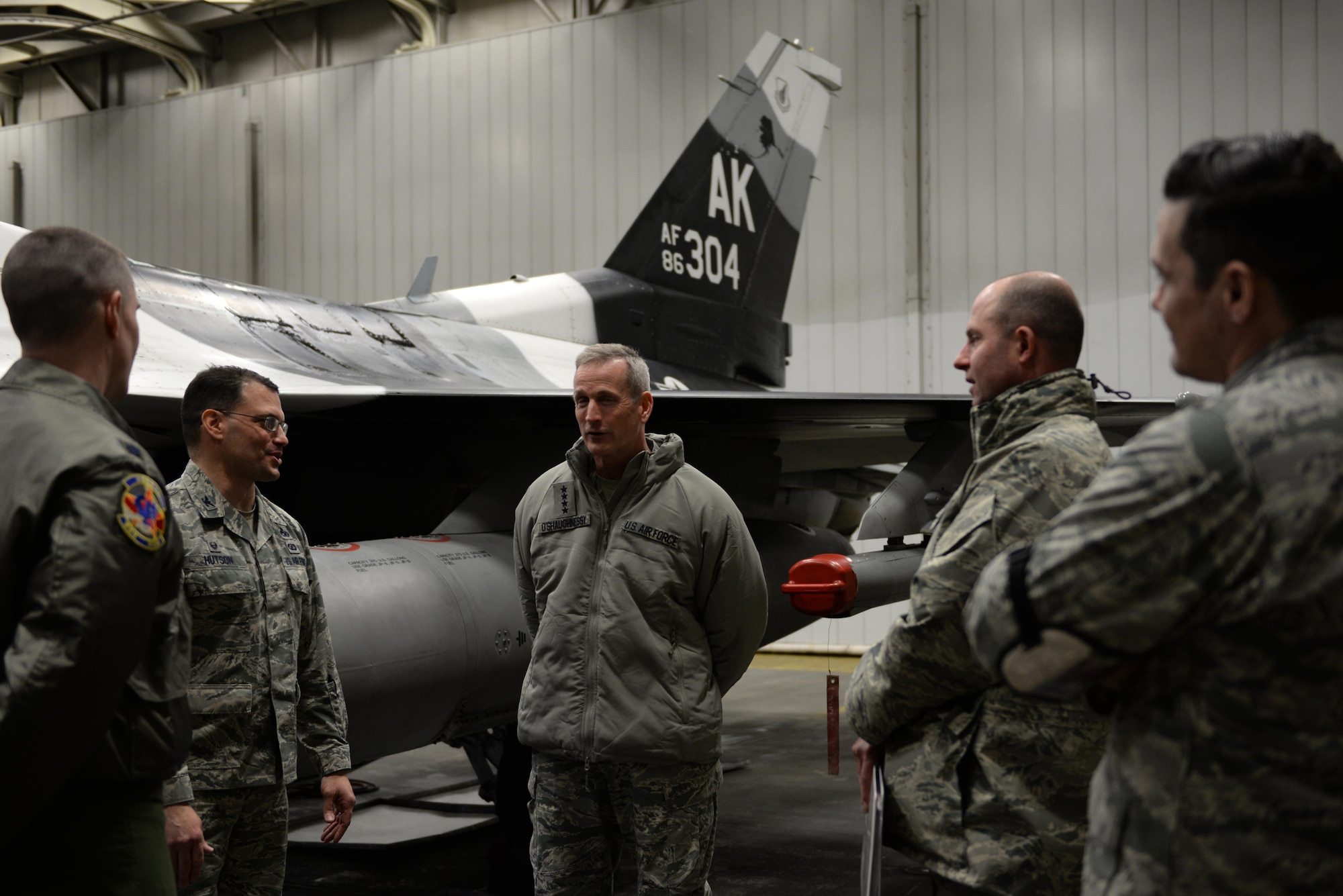 U.S. Air Force Gen. Terrence O’Shaughnessy, Pacific Air Forces commander, receives a briefing about the F-16 Fighting Falcon and how it functions in the arctic region during a base visit at Eielson Air Force Base, Alaska, Feb. 8, 2017. During the visit, O’Shaughnessy also visited with Airmen and Soldiers from Clear Air Force Station and Fort Greely to gain a better understanding of their mission capabilities and the strategic value Alaska has to offer. (U.S. Air Force photo by Airman 1st Class Cassandra Whitman)