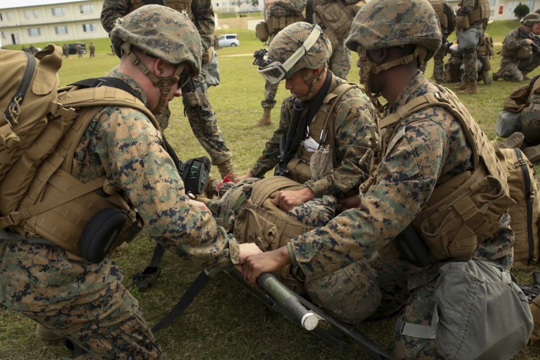 Marines and Navy corpsmen with Combat Logistics Battalion 31, 31st Marine Expeditionary Unit, treat a mock casualty during mass casualty response training at Camp Foster, Okinawa, Japan, Jan. 31, 2017. The mass casualty exercise was part of the 31st MEU’s pre-deployment training, known as Marine Expeditionary Unit Exercise. The Marines and Navy corpsmen train regularly to triage and evacuate injured casualties. As the Marine Corps’ only continuously forward-deployed unit, the 31st MEU air-ground-logistics team provides a flexible force, ready to perform a wide range of military operations, from limited combat to humanitarian assistance operations, throughout the Indo-Asia Pacific region. (U.S. Marine Corps Photo by Lance Cpl. Amy Phan/Released)