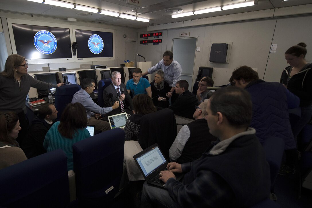 Defense Secretary Jim Mattis, center, briefs reporters while flying over the Atlantic Ocean en route to Brussels for a NATO Defense Ministerial, Feb. 14, 2017. DoD photo by Air Force Tech. Sgt. Brigitte N. Brantley