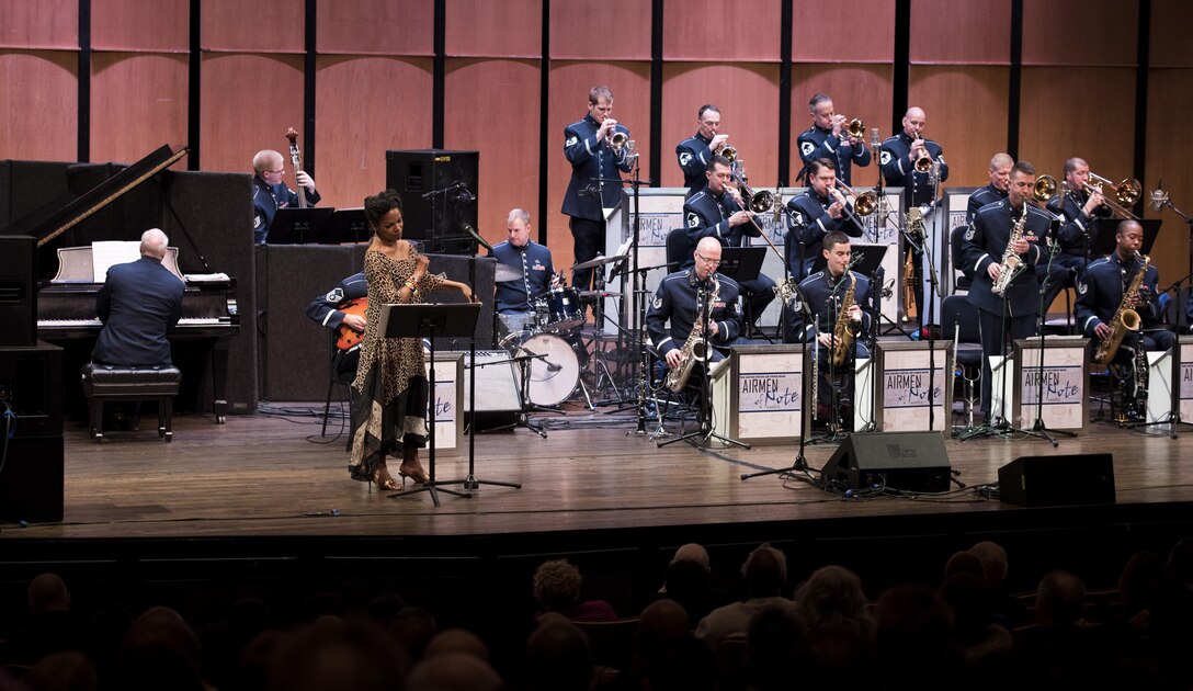 Nnenna Freelon, vocalist, sings alongside the U.S. Air Force Band Airmen of Note during a 2017 Jazz Concert Series performance at the Rachel M. Schlesinger Concert Hall and Arts Center in Alexandria, Va., Feb. 9, 2017. The concert series began in 1990 and has showcased many notable jazz musicians, including pianist Cyrus Chestnut, trumpeter Terell Stafford and saxophonist Kirk Whalum. (U.S. Air Force photo by Airman 1st Class Gabrielle Spalding)