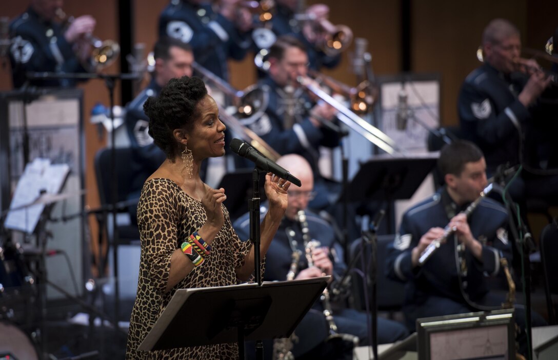 Nnenna Freelon, vocalist, sings alongside the U.S. Air Force Band Airmen of Note during a 2017 Jazz Concert Series performance at the Rachel M. Schlesinger Concert Hall and Arts Center in Alexandria, Va., Feb. 9, 2017. Freelon, a six-time Grammy nominee, has toured with many jazz artists, including Ellis Marsalis and Ray Charles. (U.S. Air Force photo by Airman 1st Class Gabrielle Spalding)