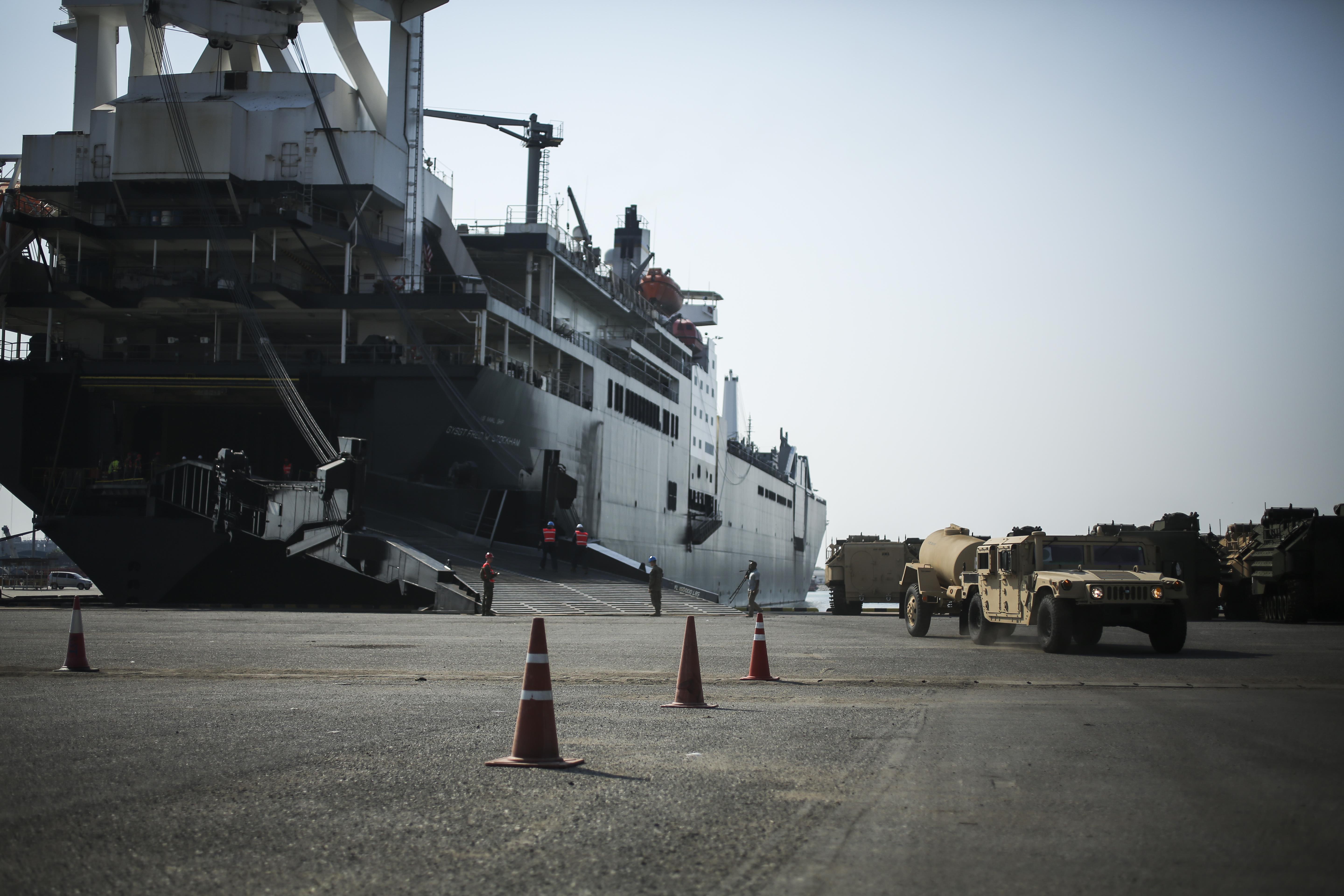 A U.S. Marine with Combat Logistics Battalion 4, drive a High Mobility Multipurpose Wheeled Vehicle off the USNS Fred W. Stockham, during exercise Cobra Gold, at Laem Chabang International Terminal, Thailand, Feb. 11, 2017. Cobra Gold, in its 36th iteration, is an important element of the United States' and all other participating nations' regional military to military engagement efforts. (U.S. Marine Corps photo by Cpl. Wesley Timm)