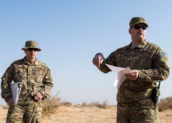 Tech. Sgt. Michael Stuenzi, 332nd Expeditionary Civil Engineer Squadron explosive ordnance disposal technician and Master Sgt. Neil Gertiser, 332nd ECES EOD flight chief, brief a group on rules and operations before a detonation, Feb. 11, 2017, in Southwest Asia. The 332nd ECES EOD Flight facilitated a detonation with the help of U.S. Marine Corps EOD technicians and coalition partners. (U.S. Air Force photo by Staff Sgt. Eboni Reams) 