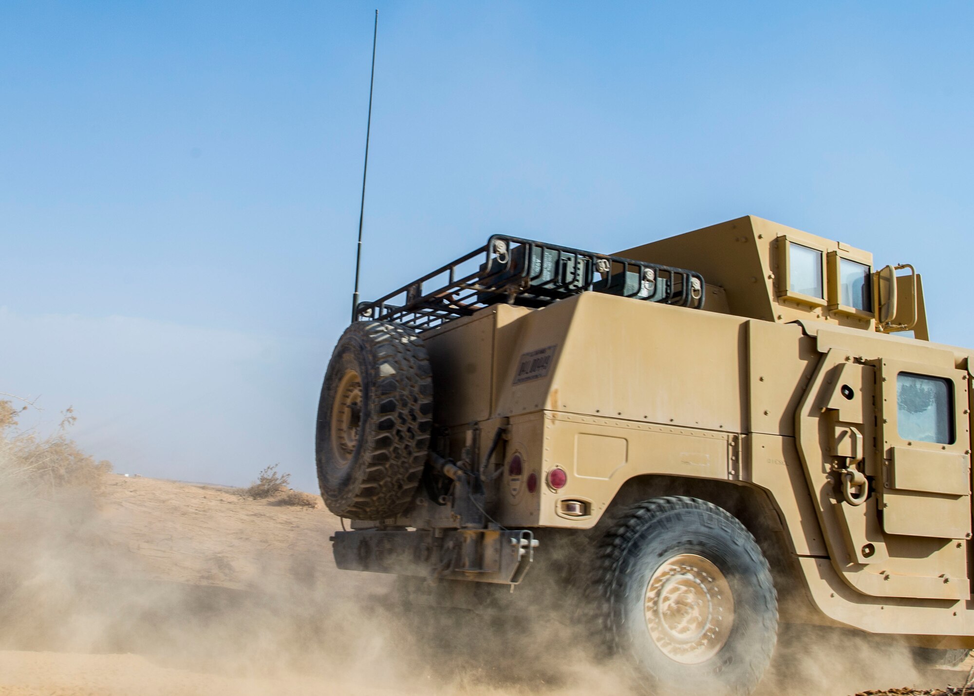 Explosive ordnance disposal technicians from the 332nd Expeditionary Civil Engineer Squadron drive a Humvee on a range during a detonation event in Southwest Asia, Feb. 11, 2017. The 332nd ECES EOD Flight facilitated a detonation with the help of U.S. Marine Corps EOD technicians and coalition partners. (U.S. Air Force photo by Staff Sgt. Eboni Reams)
