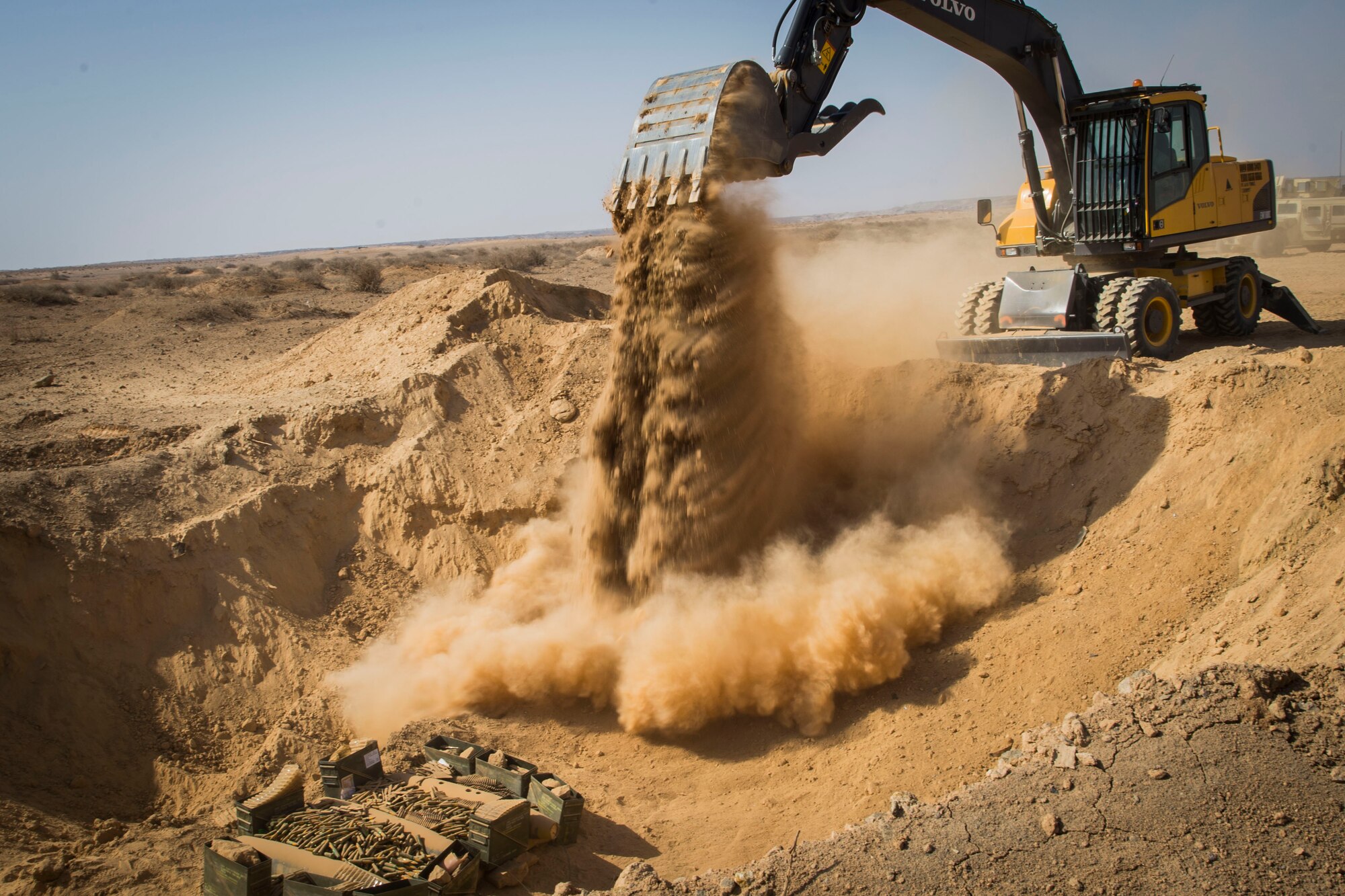 A 332nd Expeditionary Civil Engineer Squadron ‘dirt boy’ fills a hole with dirt before a range detonation, Feb. 11, 2017, in Southwest Asia. The hole is filled to level ground prior to detonating. (U.S. Air Force photo by Staff Sgt. Eboni Reams)