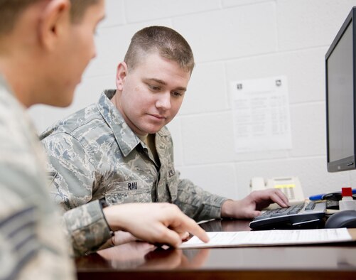 Tech. Sgt. Steve Rau, a paralegal at the 167th Airlift Wing in Martinsburg, W.Va., works with a unit member to complete a will, January 8, 2017. Creating or updating a will can be done by contacting the base JAG office.