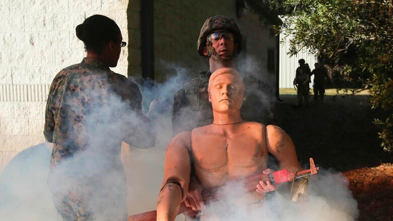 Corpsmen transport a notional patient onto an aircraft during a Tactical Combat Casualty Care training exercise at Marine Corps Base Camp Lejeune, North Carolina, Feb. 6-10, 2017. The TCCC teaches corpsmen new communication skills and how to care for a patient in a combat zone. The corpsmen are with 2nd Medical Battalion. 