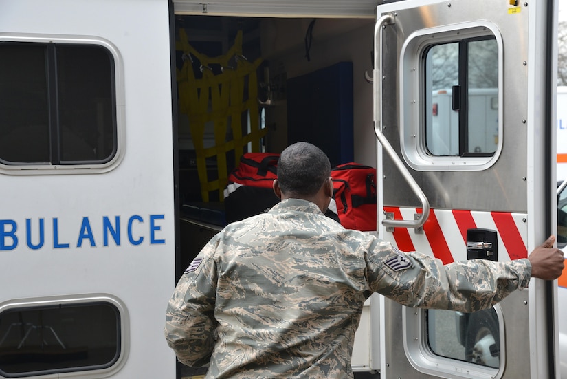 U.S. Air Force Staff Sgt. Terrance Thomas, 633rd Medical Group emergency technician, finishes an ambulance equipment check at Joint Base Langley-Eustis, Va., Jan 13, 2017. While at an emergency scene, the ambulance services work side-by-side with the 633rd Civil Engineer Squadron fire department and the 633rd Security Forces Squadron personnel who would also respond to the 911 call. (U.S. Air Force photo by Airman 1st Class Tristan Biese)
