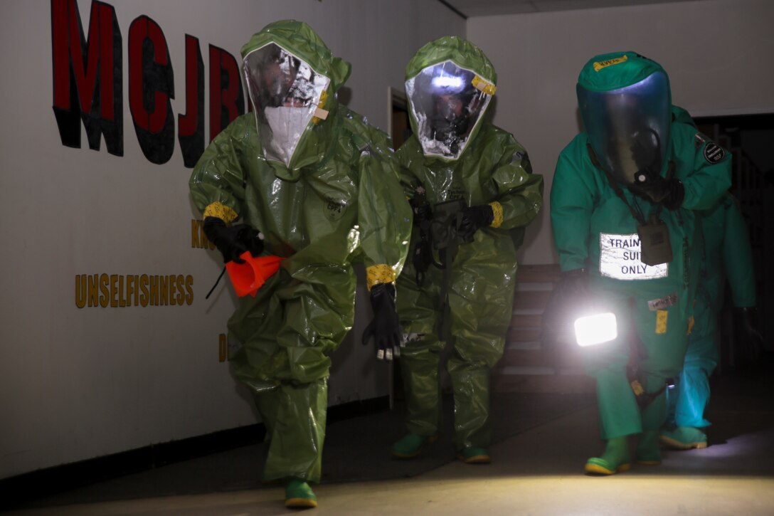 (From left to right) Sgt. Nikolas Bruce, chemical, biological, radiological and nuclear defense reconnaissance fireteam leader, Lance Cpl. Thomas Paulson, CBRN defense specialist and Lance Cpl. Jonathan White, CBRN defense specialist with Combat Logistics Regiment 45, 4th Marine Logistics Group, Marine Forces Reserve, conduct reconnaissance of an abandoned building during an assessment and consequence management team training exercise at Marine Corps Support Facility, New Orleans, Feb. 8, 2017. During the exercise, Marines practiced responding to a chemical threat. The Marines conducted area reconnaissance, sample collection and classification of unknown substances. (United States Marine Corps photo by Sgt. Ian Ferro/Published)