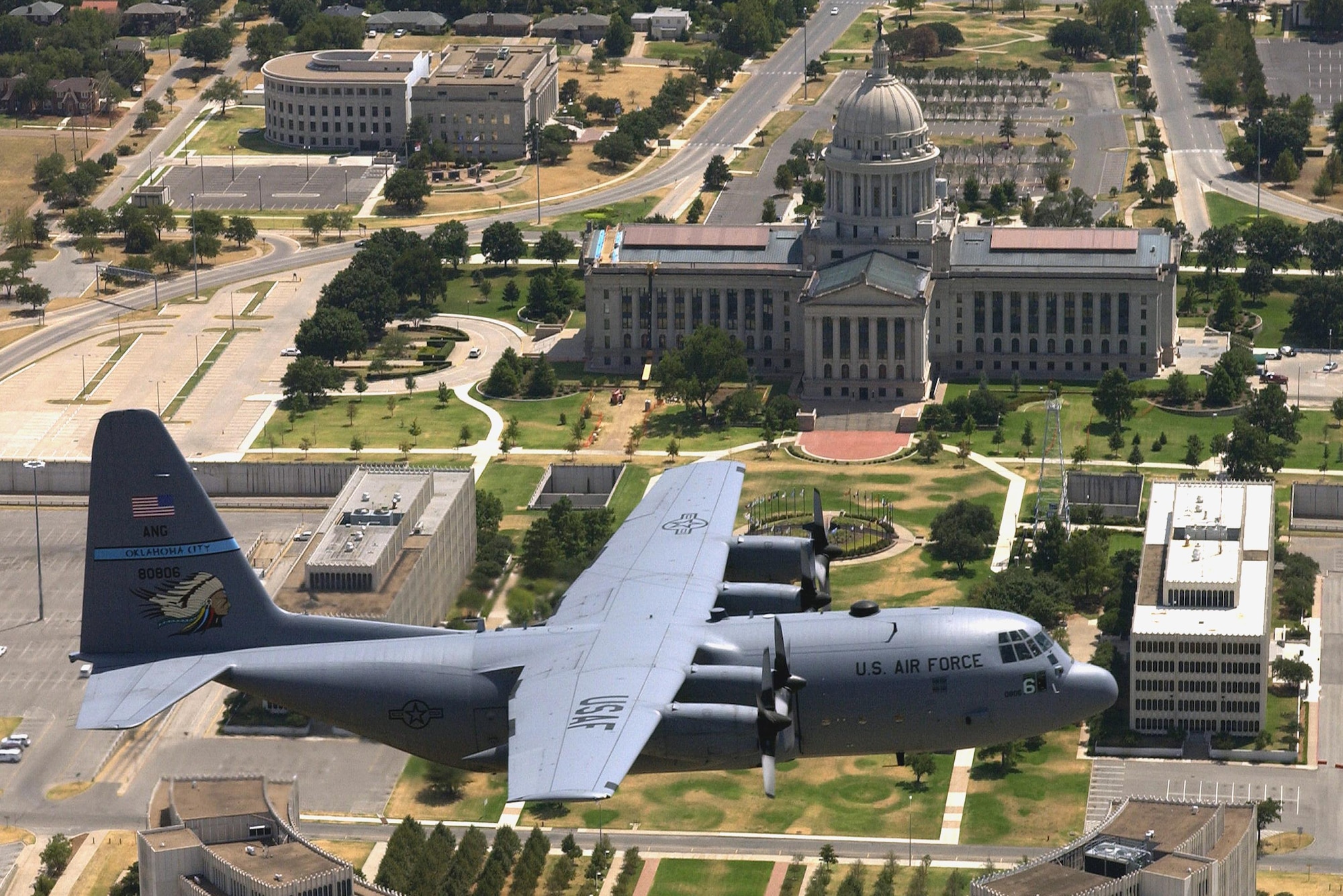 A C-130 Hercules from the 137th Airlift Wing flies over the Oklahoma State Capitol, Aug. 14, 2006.
