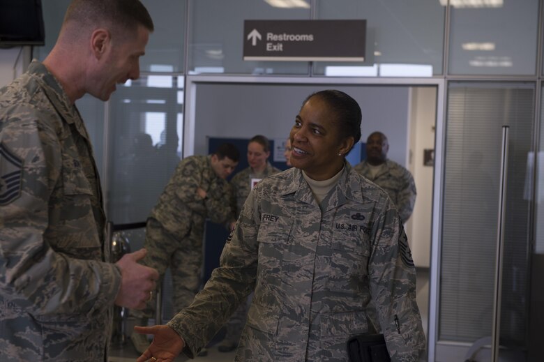 Chief Master Sgt. Shelina Frey, Air Mobility Command command chief, greets Airmen as she arrives at the 726th Air Mobility Squadron at Spangdahlem Air Base, Germany, Feb. 13, 2017. Frey visited with AMC Airmen stationed at both Ramstein Air Base and Spangdahlem Air Base, Germany during her visit. The 726th Air Mobility Squadron provides air transportation, cargo, maintenance and enroute support to Allied and American forces. (U.S. Air Force photo by Senior Airman Dawn M. Weber)