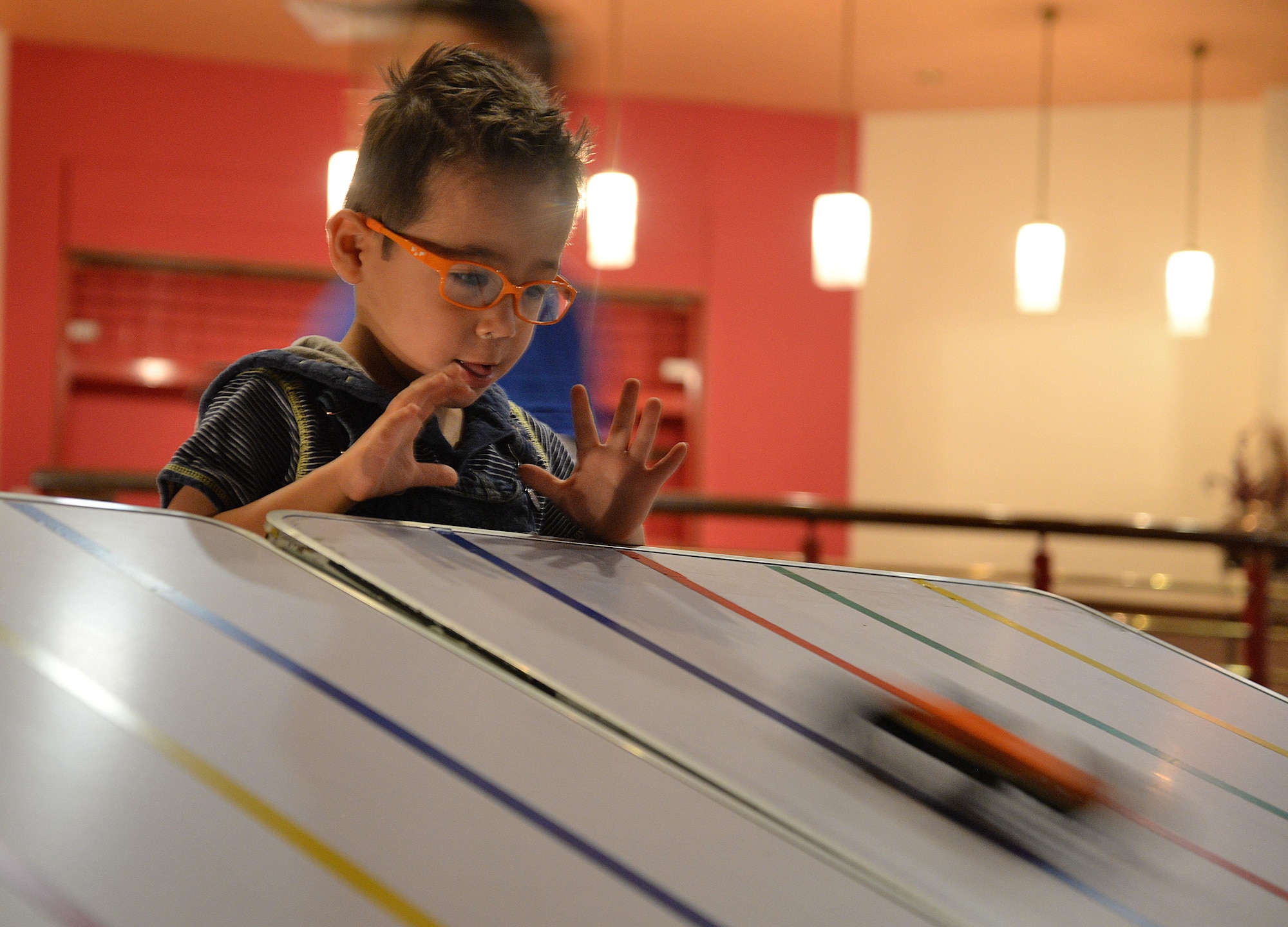 Son of U.S. Air Force Staff Sgt. Christopher Hassell, 372nd Training Squadron Det. 2 propulsions systems instructor, races a building block car he created during a “Young Engineer Camp” event Feb. 11, 2017, on RAF Mildenhall, England. The Airman and Family Readiness Center hosted the event for families of the Exceptional Family Member Program. (U.S. Air Force photo by Senior Airman Christine Halan)