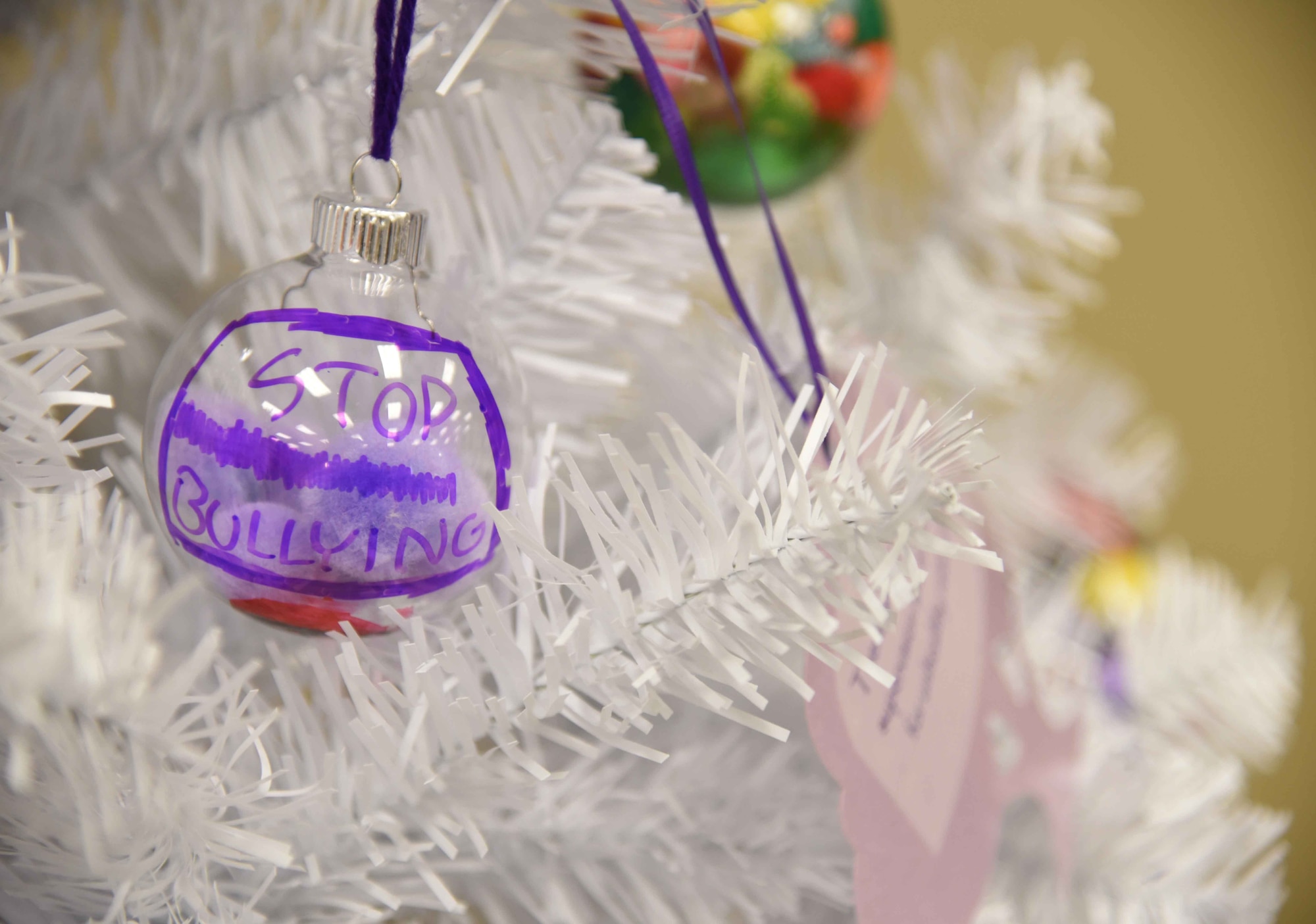 A remembrance tree with 25 ornaments displaying facts about Teen Dating Violence Awareness Month is located in McConnell’s Youth Center during the month of February. Children created their own ornaments in recognition of the observance. (U.S. Air Force photo/Airman 1st Class Erin McClellan)
