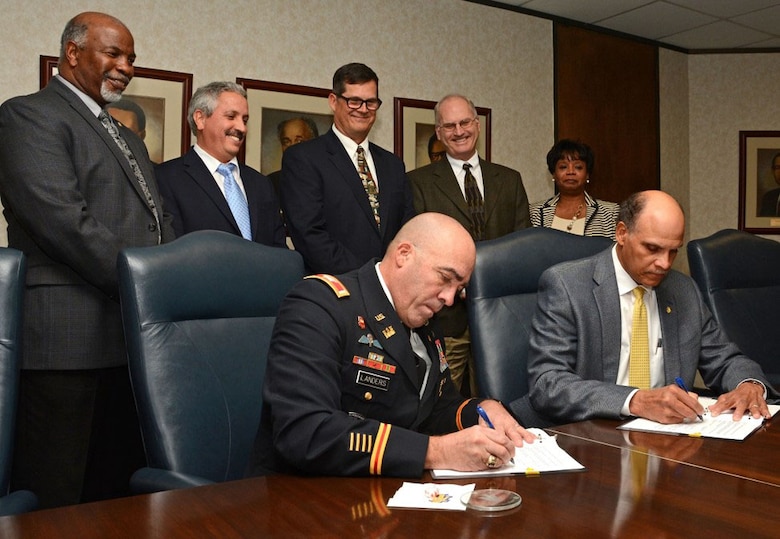 Wilmington District Commander, Col. Kevin Landers, Sr., and North Carolina Agriculture and Technical State University Chancellor Dr. Harold Martin sign a STEM partnership agreement in Greensboro.