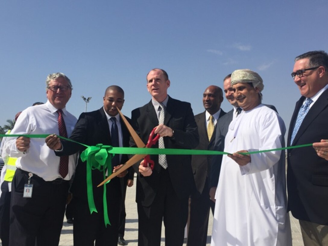 (Left to right) David Gledhill, chief executive officer, Port of Salalah; Peter A. Boone, deputy commander, DLA Distribution Bahrain; Army Brig. Gen. Martin A. Chapin, commanding general, DLA Energy; Navy Capt. Terrel Fisher, forward commander, DLA CENTCOM & SOCOM; Army Col. Eric J. Larson, senior defense official and defense attaché, US Embassy Muscat; Hamdan Al Hinai, director of procurement and contracts, Office of the Secretary General, Ministry of Defence; and Paul McMillan, area manager, DLA Disposition Europe cut the ribbon on the newest material processing center in Salalah, Oman on Feb. 9.