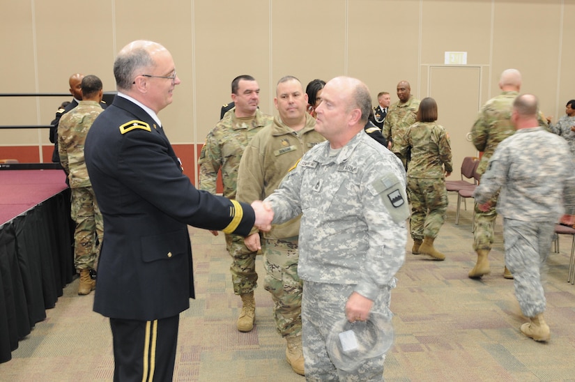 Brig. Gen. Thomas P. Evans, deputy commanding general of the 80th Training Command, says goodbye to Master Sgt. Jeff Constantine, of the 80th's Systems Integration Management Office, at Evans' retirement ceremony at the Defense Supply Center in Richmond, Virginia, Feb. 11, 2017. (Photo by Master Sgt. Stacey Everett, 80th Training Command Headquarters and Headquarters Company)