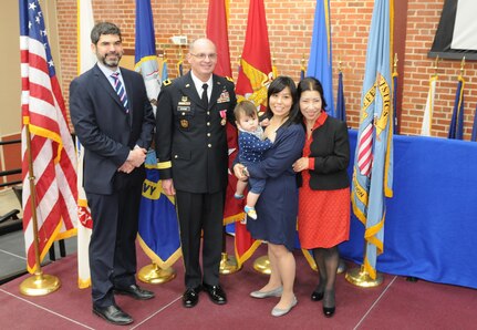 Brig. Gen. Thomas P. Evans, deputy commanding general of the 80th Training Command, poses for pictures with his family at his retirement ceremony held at the Defense Supply Center in Richmond, Virginia, Feb. 11, 2017. (Photo by Master Sgt. Stacey Everett, 80th Training Command Headquarters and Headquarters Company)