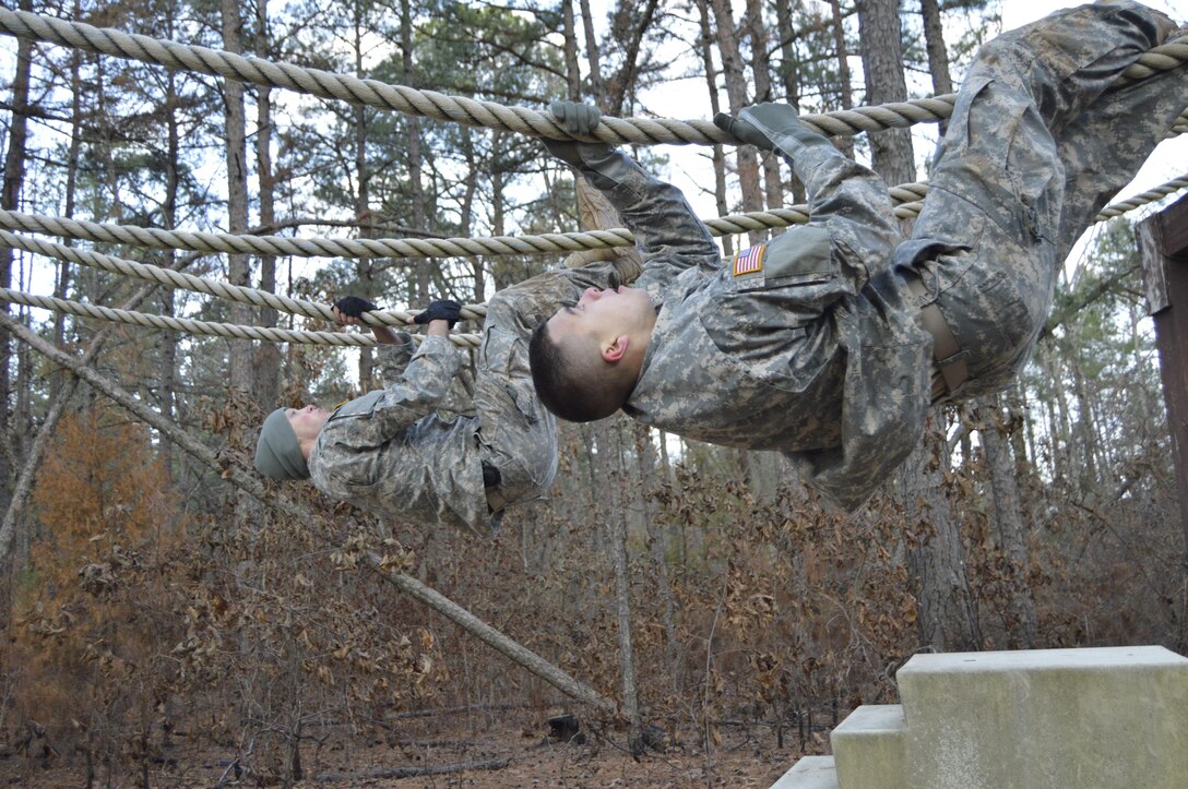 Participants in the 4th ESC Best Warrior Competition navigate a rope obstacle.  The 4th ESC held its 2017 Best Warrior Competition at Camp Parks, AR, Feb. 3-5, 2017.  (U.S. Army Reserve photo by Army Master Sgt. Dave Thompson)