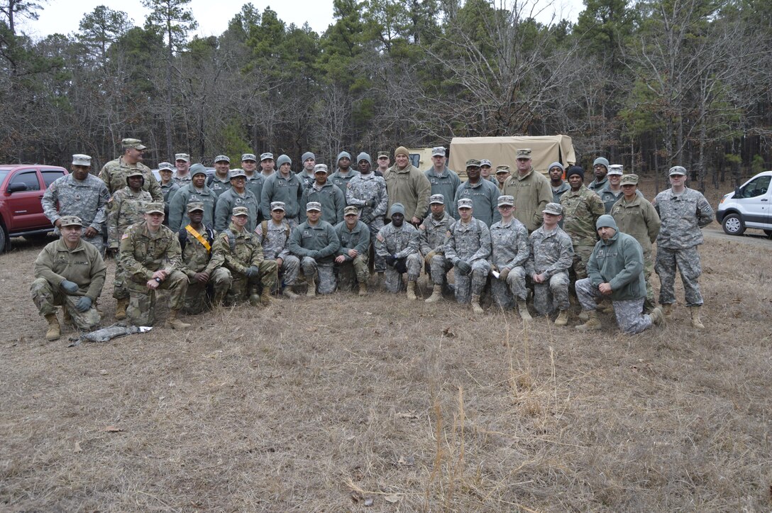 Participants in the 4th ESC Best Warrior Competition pose for a group picture before a land navigation evaluation.  The 4th ESC held its 2017 Best Warrior Competition at Camp Parks, AR, Feb. 3-5, 2017.  (U.S. Army Reserve photo by Army Master Sgt. Dave Thompson)