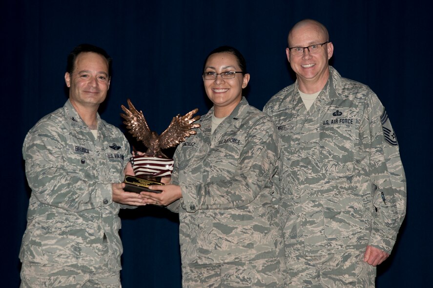 U.S. Air Force Reserve Col. Anthony Brusca, interim commander for the 913th Airlift Group, 1st Lt. Jamillah Gonzalez, 913th Airlift Group Staff and Chief Master Sgt. Paul Stewart, superintendent, 913 AG, pose for a photo during the Group Commander’s Call Feb. 12, 2017, at Little Rock Air Force Base, Ark. Gonzalez was the 913th Airlift Group’s Annual Award Winner in the Company Grade Officer Category for 2016. (U.S. Air Force photo by Master Sgt. Jeff Walston/Released)